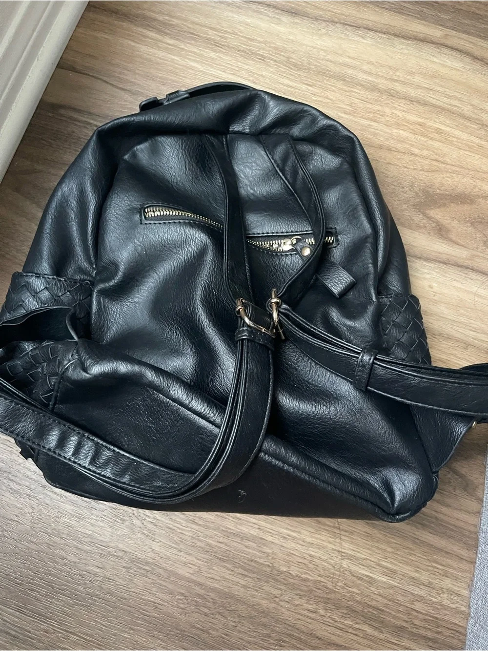 Woven Black Leather Backpack with Gold Accents